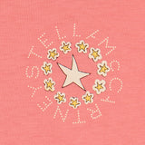 Pink knit t-shirt with a central white star surrounded by smaller yellow stars, encircled by dotted white letters spelling 'S