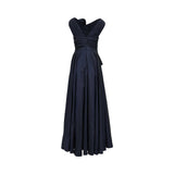 Back view of a TALBOT RUNHOF navy gown showing the elegant V-shaped back, structured pleating at the waist, and the expansive floor-length hem.
