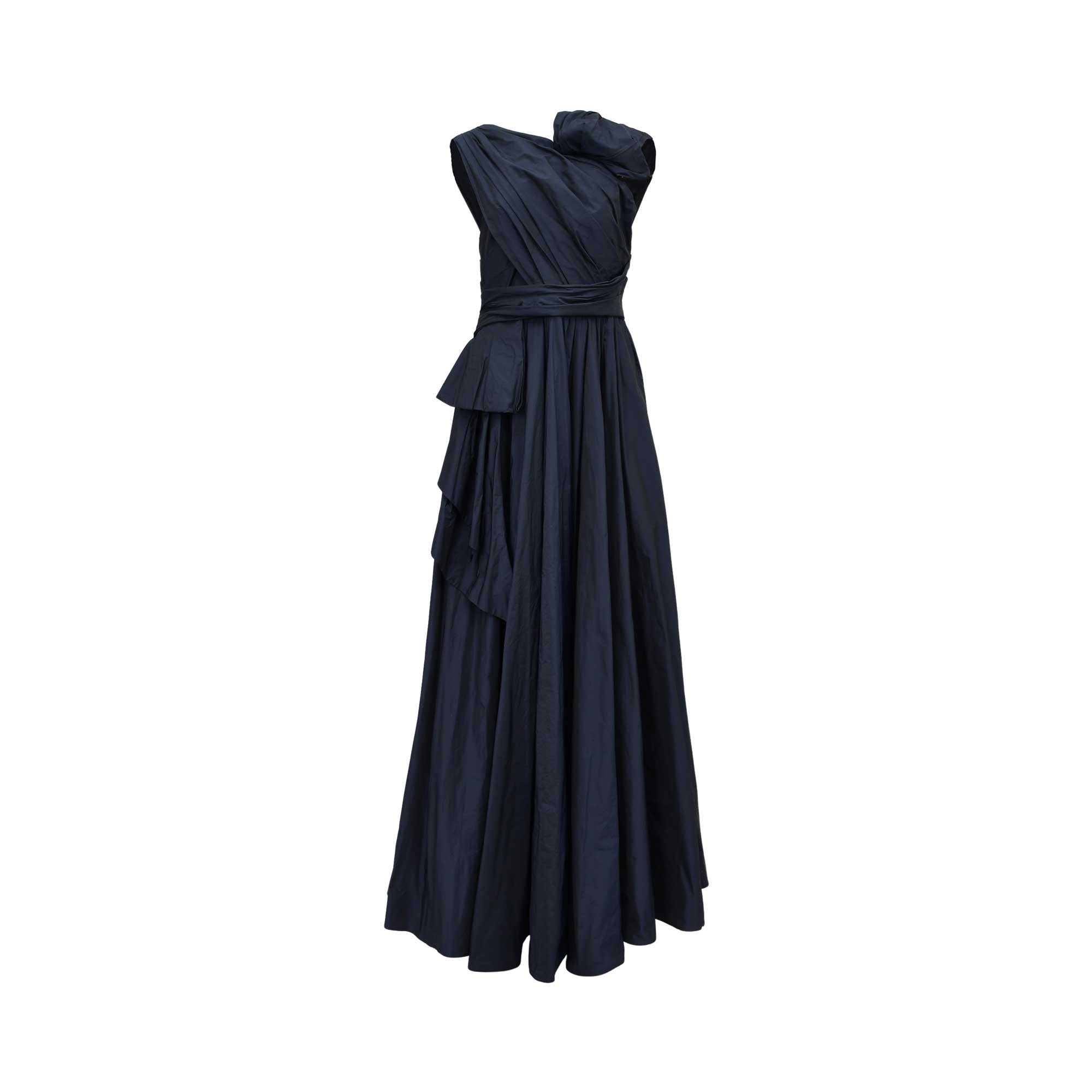 Front view of a TALBOT RUNHOF navy blue taffeta gown featuring asymmetric pleating, a sculptural shoulder detail, and a full, draped A-line skirt.