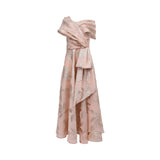 Front view of a TALBOT RUNHOF rose pink and gold floral jacquard gown featuring a draped off-the-shoulder neckline and a side-waist architectural fold.