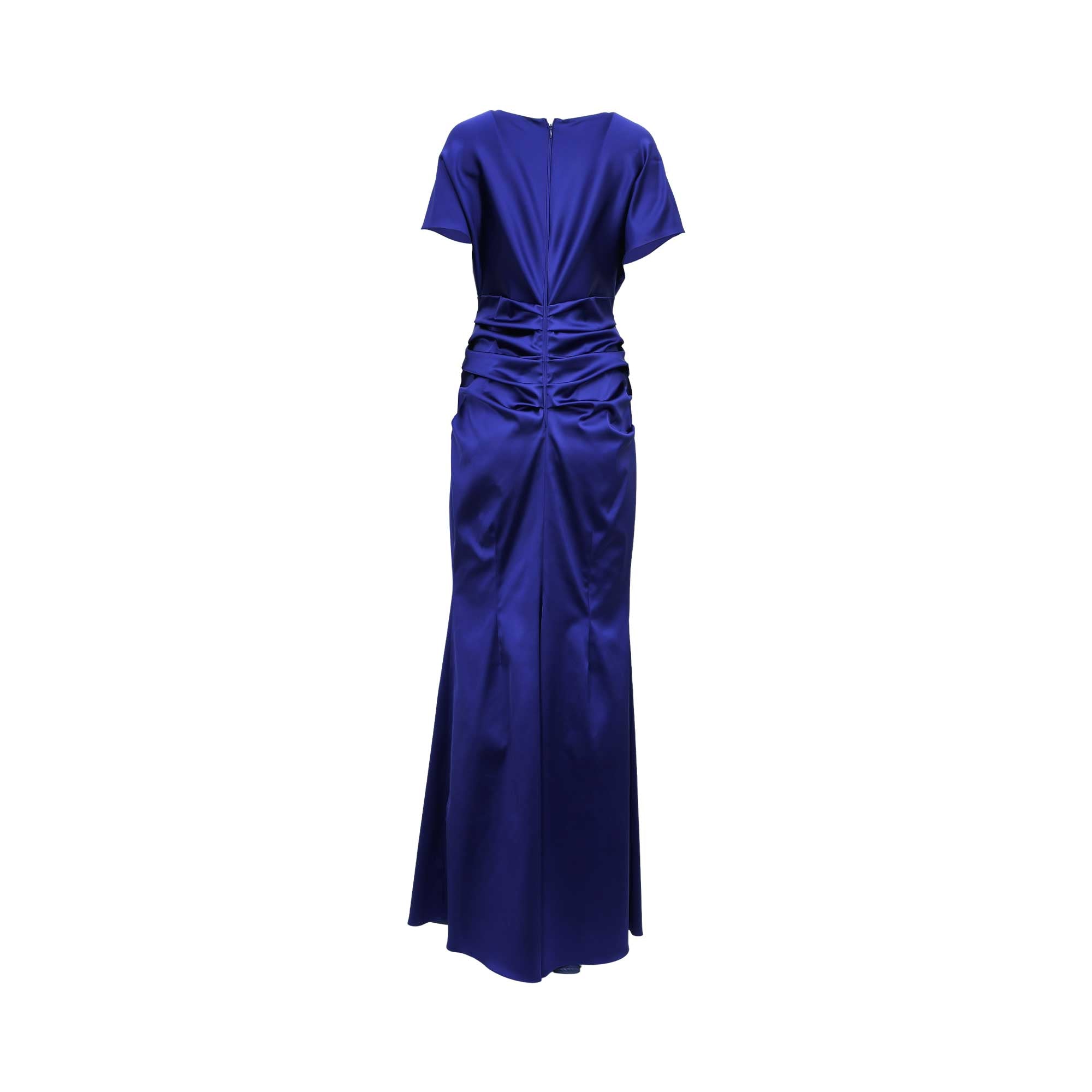Rear view of the royal blue satin gown highlighting the central zipper, structured shoulder draping, and horizontal ruched detailing through the lower back.