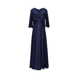 A front view of a navy blue Talbot Runhof satin gown, showing the V-neckline, central twist-knot draping at the waist, and three-quarter sleeves.