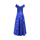 Rear view of the royal blue jacquard gown showing the structured V-back, central zipper, and elegant gathered fabric details at the waist and shoulders.