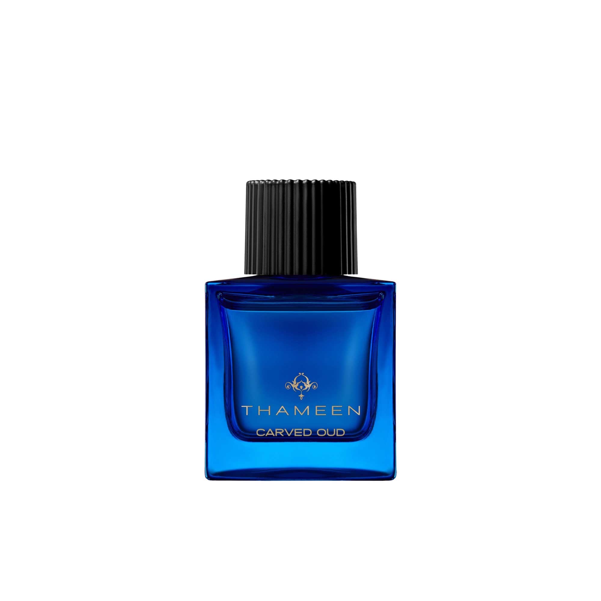 A 50ml square vibrant blue glass bottle of Thameen Carved Oud featuring gold lettering and topped with a textured black cylindrical cap.