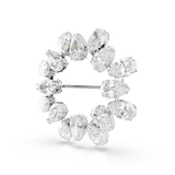 A three-quarter studio perspective view looking from the left side of the Swarovski Matrix brooch, illustrating the uniform clarity of the clear stones and how the polished rhodium-plated edges catch the light.