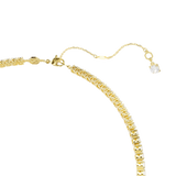 A three-quarter perspective studio view of the Swarovski Matrix Y necklace, illustrating the fluid drape, dimensional layering of the center drop, and the warm golden prongs holding each crystal.