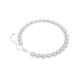 A three-quarter perspective studio view of the Swarovski Una Angelic necklace, demonstrating the fluid connection between the rhodium-plated links and the dimensional depth of the cushion-cut stones.