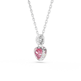 A three-quarter perspective studio view of the Swarovski Chroma heart pendant, illustrating the dimensional, thick setting of the pink heart crystal and the pavé crystal detailing along the bail.