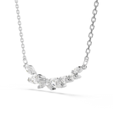 A three-quarter perspective studio layout of the Swarovski Mesmera necklace, illustrating the dimensional, angled arrangement of the cascading marquise crystal cluster.