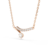 A three-quarter perspective studio layout of the Swarovski Matrix necklace, showcasing the dimensional arch of the crystal bar and the way the brilliant round drop stone catches the light.