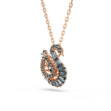 A three-quarter studio perspective view of the Swarovski Swan pendant, emphasizing the multi-dimensional layout and distinct textures of the baguette, round, and marquise black crystals.
