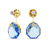 A dynamic three-quarter perspective view of the Swarovski Gema earring jackets, illustrating the impressive depth and faceting of the geometric blue crystal stones against the bright 18K gold plating.