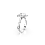 A dynamic three-quarter perspective studio view of the Swarovski Una Angelic halo ring, illustrating how the single row of pavé crystals travels elegantly down the shoulder of the reflective rhodium-plated setting.