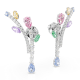 A dynamic three-quarter studio perspective of the Swarovski Ariana Grande drop earrings angled slightly inward, illustrating the three-dimensional depth of the crystal branch layout and the reflective rhodium finish.