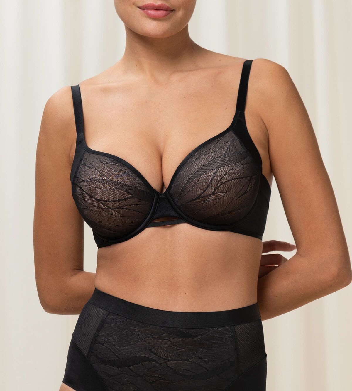 Triumph Airy Sensation black padded bra third model front view, with breathable mesh wings. Shop the latest Online.