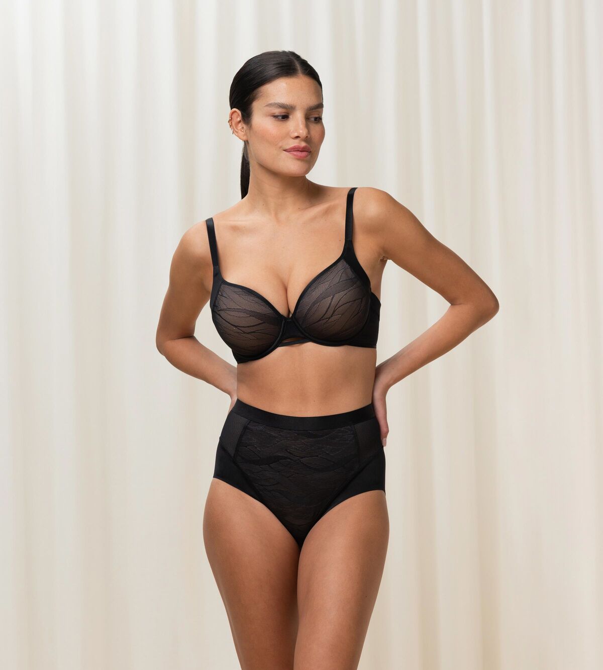 Triumph Airy Sensation black padded bra third model full front view, with breathable mesh wings. Shop the latest Online.