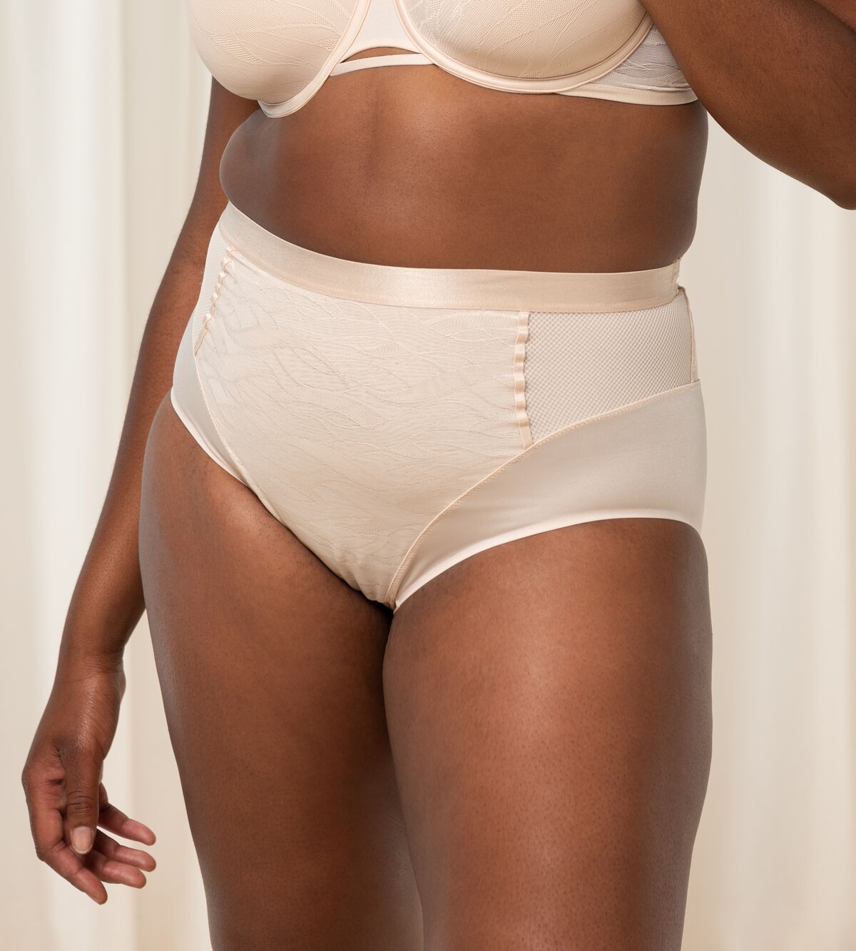 Triumph Airy Sensation nude beige maxi panty second model front view, with shaping mesh panels. Shop Now at Blue Salon Qatar
