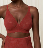 Triumph Amourette 300 Rococo non-wired bra in mannish red second model close-up view, detailing the intricate floral lace and fit. Order Online Today