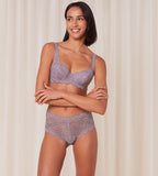 Triumph Amourette 300 maxi panty in purple model full front view, featuring high-waisted floral lace and smooth microfiber back. Find Online Now
