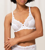 Triumph Amourette 300 white non-wired bra third model front view, featuring unpadded floral lace cups. Available Now at Blue Salon Qatar
