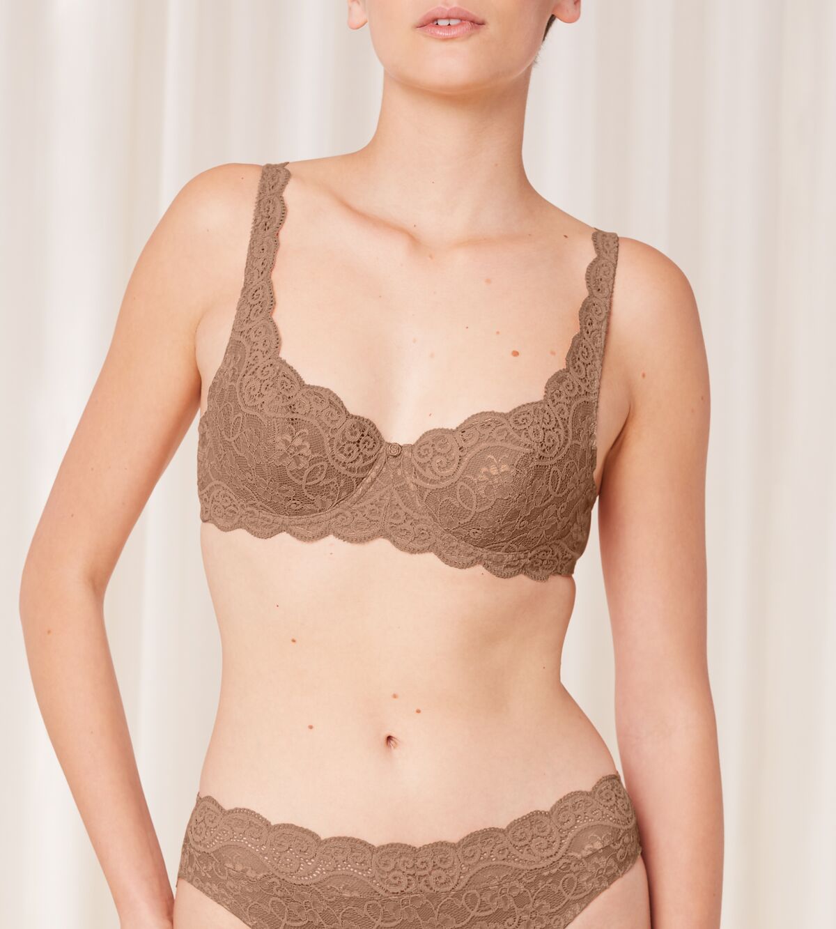 Triumph Amourette 300 wired padded bra in Toast model front view, featuring lace-overlaid padded cups and supportive underwiring. Available Now at Blue Salon Qatar