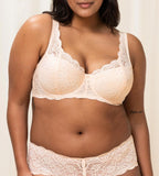 Triumph Amourette 300 wired padded bra in light beige model front view, showing the floral lace overlay and smooth padded cups. Available for Online Purchase