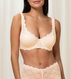 Triumph Amourette 300 wired padded bra in light beige second model front view, showing the floral lace overlay and smooth padded cups. Available for Online Purchase