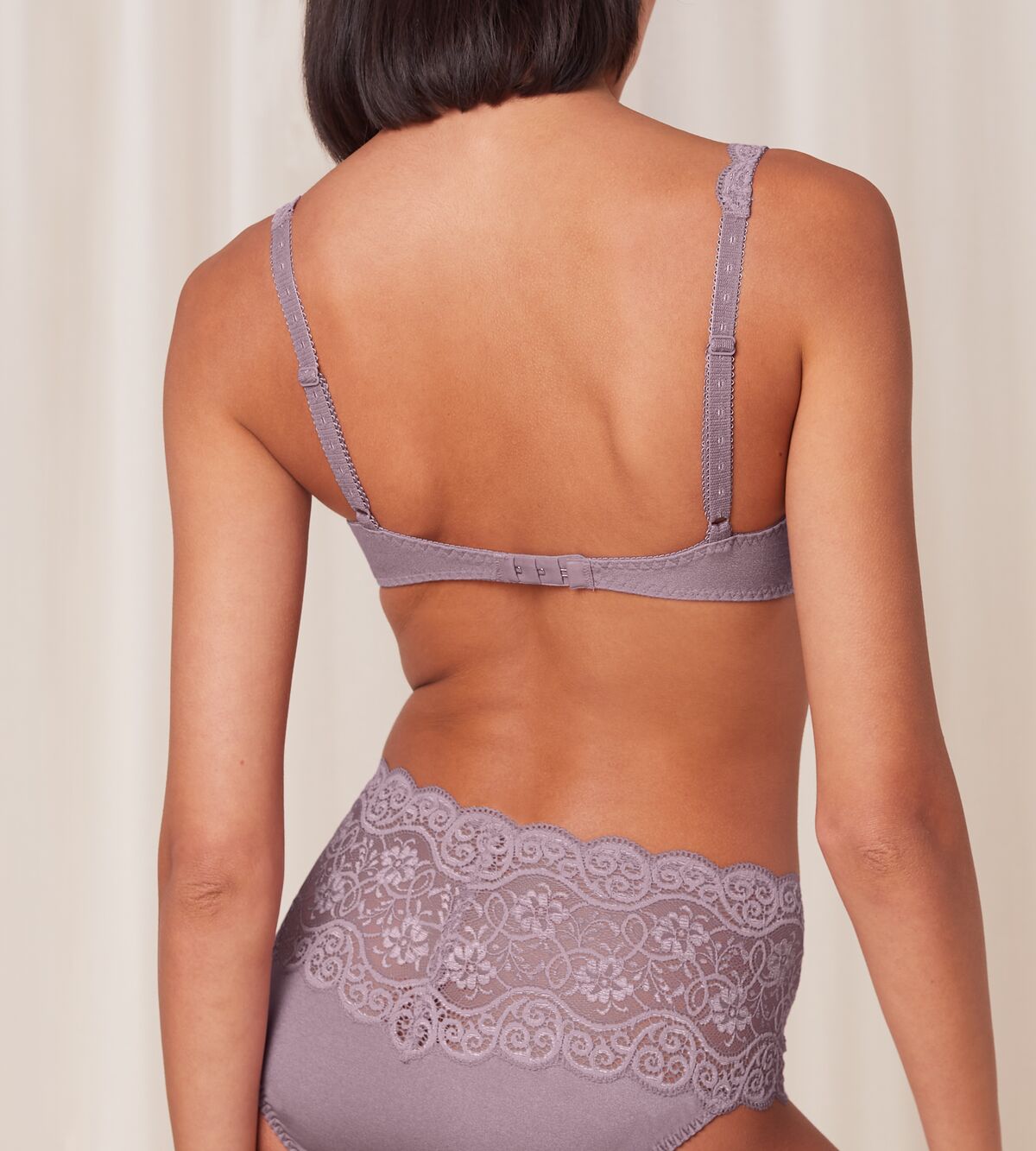 Triumph Amourette 300 wired padded bra in purple model back view, showcasing adjustable straps. Shop Online Today