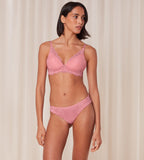Triumph Amourette Charm Brazilian panties in pink model full front view, showcasing the floral lace and modern cheeky cut. Order Online Today