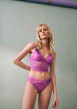 Triumph Amourette Charm Summer Tai panty in pink model full front view, showcasing fit and the high-leg floral lace design. Shop Online at Blue Salon Qatar