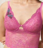 Triumph Amourette Charm Summer longline bustier in Pink third model close-up view, detailing the floral lace design and extended under-bust band. Available Online at Blue Salon Qatar