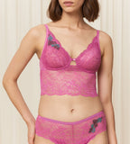 Triumph Amourette Charm Summer longline bustier in Pink third model front view, showcasing the floral lace and extended under-bust band. Available Online at Blue Salon Qatar