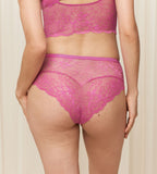Triumph Amourette Charm Summer maxi panty in pink model back view, featuring breathable floral lace and a seamless high-waist finish. Shop the Latest Online