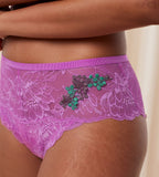 Triumph Amourette Charm Summer maxi panty in pink model close-up view, detailing breathable floral lace and a seamless high-waist finish. Shop the Latest Online