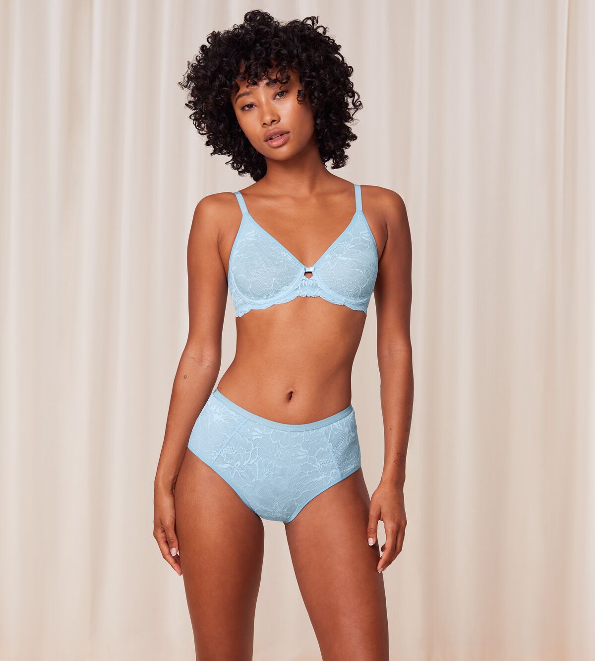 Triumph Amourette Charm T maxi panty in light blue model full front view, showing the high-waist lace design and seamless back finish. Available for Online Purchase