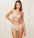 Triumph Amourette Charm maxi panties in light beige model full front view, showing the high-waist lace front and smooth microfiber back. Order Online Today