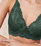 Triumph Amourette Charm non-wired bra in Smoky Green model close-up view, detailing intricate floral lace and a supportive wireless design. Shop Online Today