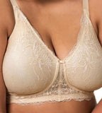 Triumph Amourette Charm non-wired bra in light beige second model close-up front view, detailing the floral lace cups and plunge neckline. Available for Online Purchase