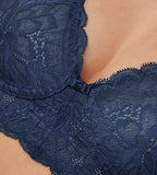 Triumph Amourette Charm non-wired bra in navy blue close-up view, detailing the floral design . Find Now Online