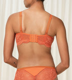 Triumph Amourette Charm non-wired bra in orange second model back view, showing adjustable straps, featuring floral stretch lace. Shop Online Today