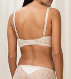 Triumph Amourette Charm wired bra in light beige model back view, showing adjustable straps and the floral lace. Available Now Online