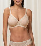 Triumph Amourette Charm wired bra in light beige model front view, showing the floral lace cups and supportive underwired construction. Available Now Online