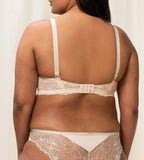 Triumph Amourette Charm wired bra in light beige second model back view, showing adjustable straps and the floral lace. Available Now Online