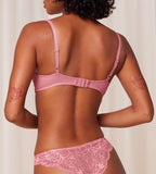 Triumph Amourette Charm wired padded bra in pink model back view, showcasing adjustable straps. Order Online Today