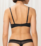 Triumph Aura Spotlight black wired padded bra model back view, showcasing adjustable straps. Shop Online
