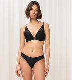 Triumph Aura Spotlight black wired padded bra model full front view, showcasing the lace-covered cups and supportive underwire. Shop Online