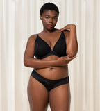 Triumph Aura Spotlight black wired padded bra second model full front view, showcasing the lace-covered cups and supportive underwire. Shop Online