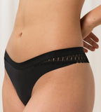 Triumph Aura Spotlight high leg string in black model second close-up side view, showcasing the narrow sides and intricate lace detailing. Available Online at Blue Salon Qatar