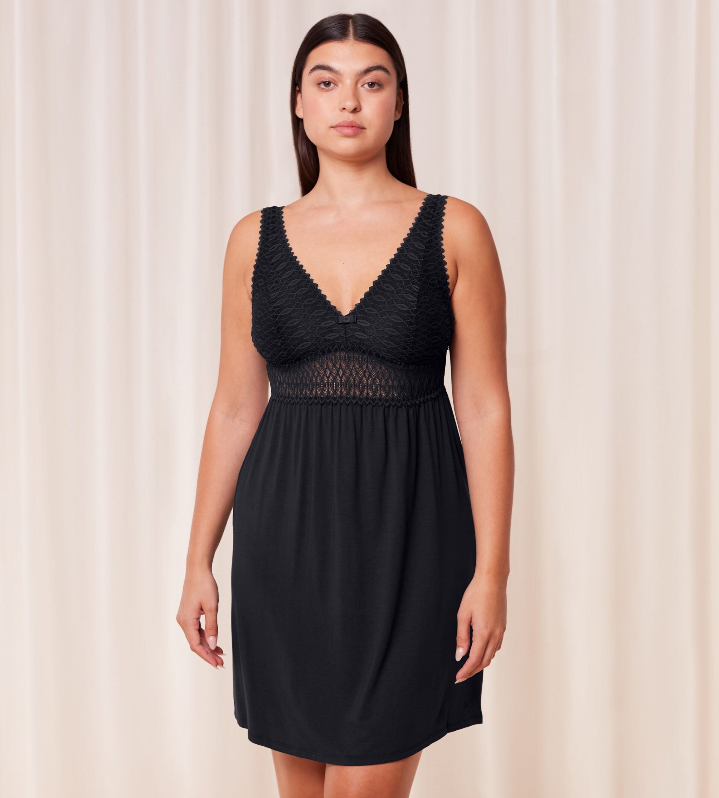 Triumph Aura Spotlight nightdress in black model front view, featuring lace-covered cups, a semi-sheer waistband. Shop Now Online