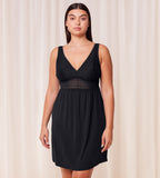 Triumph Aura Spotlight nightdress in black model front view, featuring lace-covered cups, a semi-sheer waistband. Shop Now Online